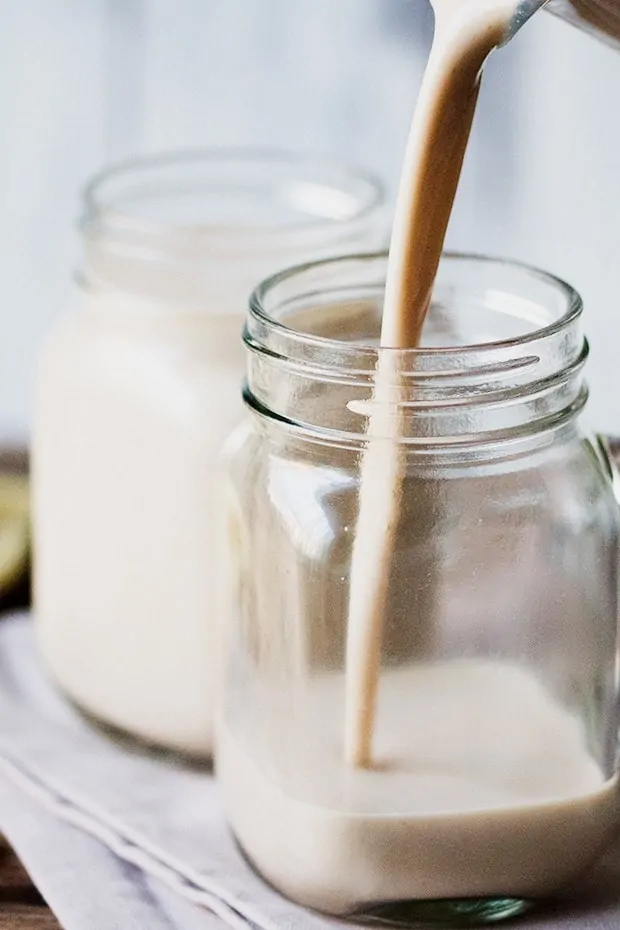 White Chocolate Coconut Cashew Hot Smoothie being poured into a kilner jar