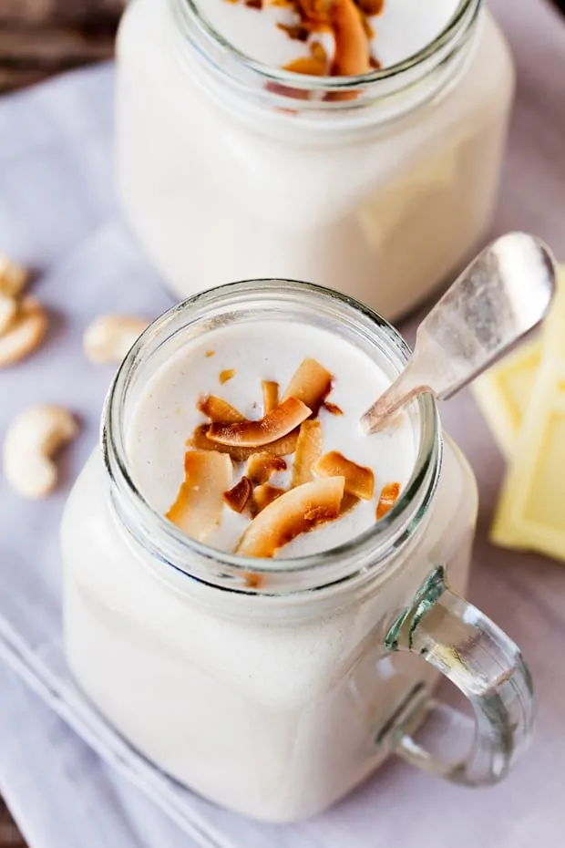 Close up overhead of White Chocolate Coconut Cashew Hot Smoothie with toasted coconut ontop