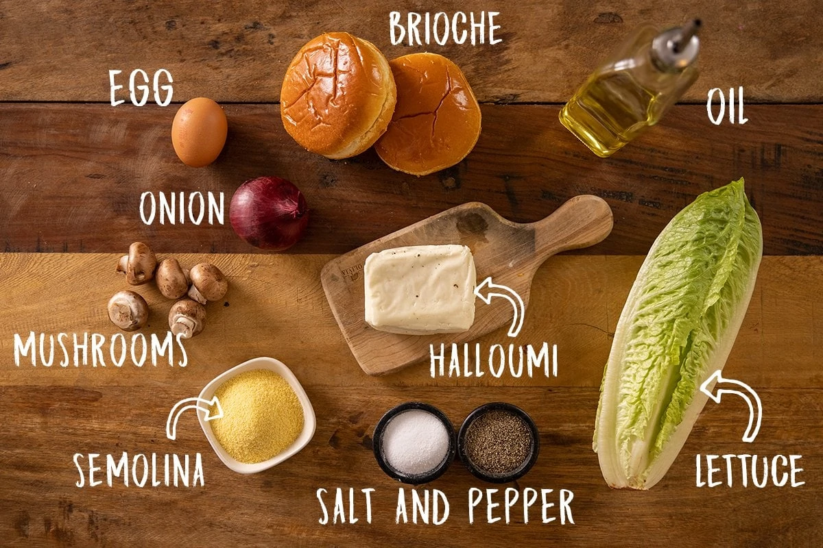Ingredients for crispy halloumi burgers on a wooden table