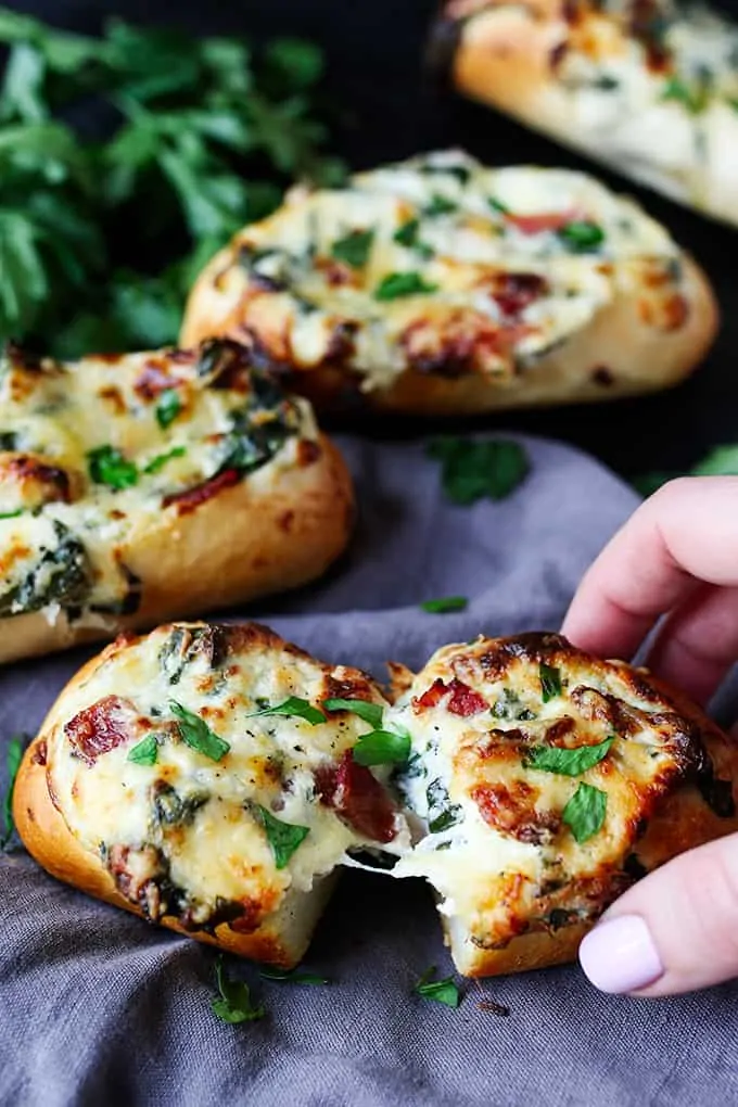 These stuffed cheesy breads with spinach and bacon use part-baked petit pans that cook at the same time as the gooey filling. Perfect for game day!!
