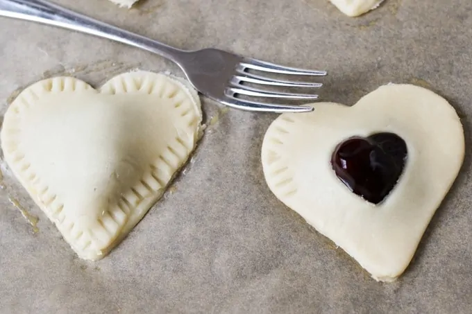 Valentine's Day Cherry Pies. Simple sugar-sprinkled cherry hand pies - a simple but thoughtful gift for your Valentine.