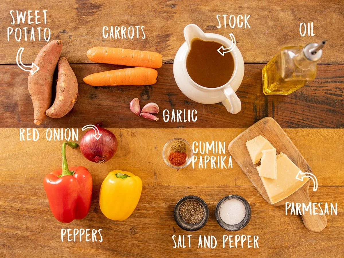 Ingredients for Roasted vegetable soup on a wooden table