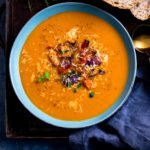 Roasted vegetable soup in a blue bowl