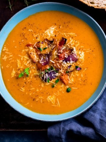 Roasted vegetable soup in a blue bowl