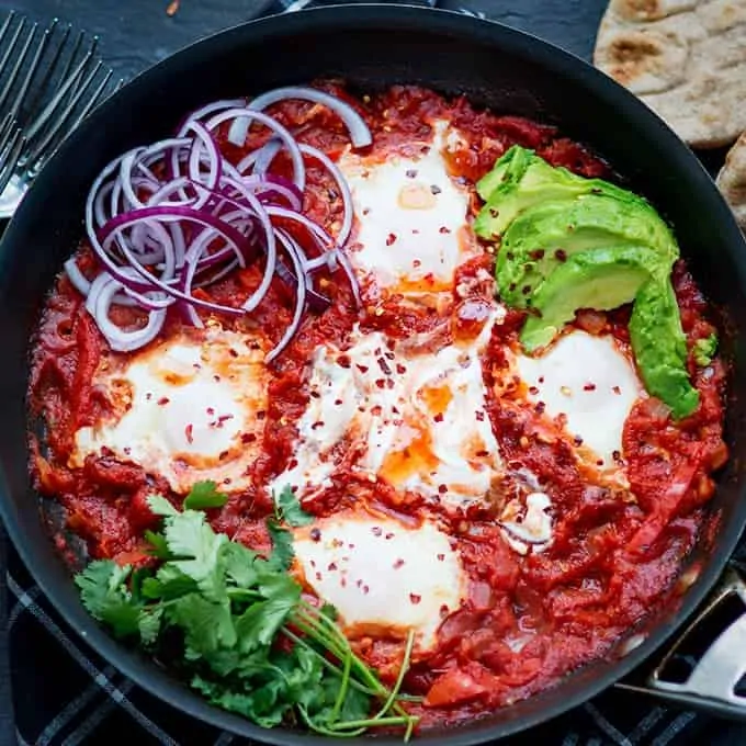 Mexican Shakshuka - dippy eggs poached in a rich Cajun tomato sauce.