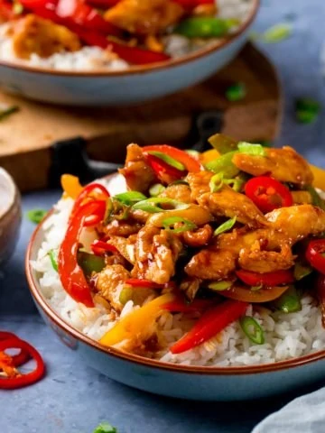 chicken stir fry in a bowl with rice
