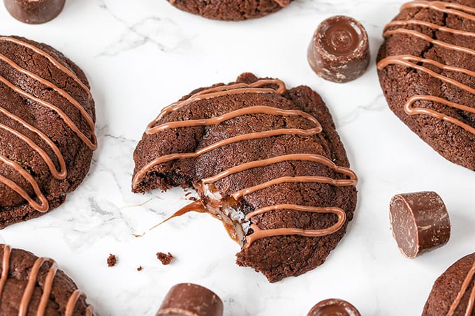 Gooey Rolo Stuffed Cookies. Chewy Chocolate cookies with a gooey Rolo centre!