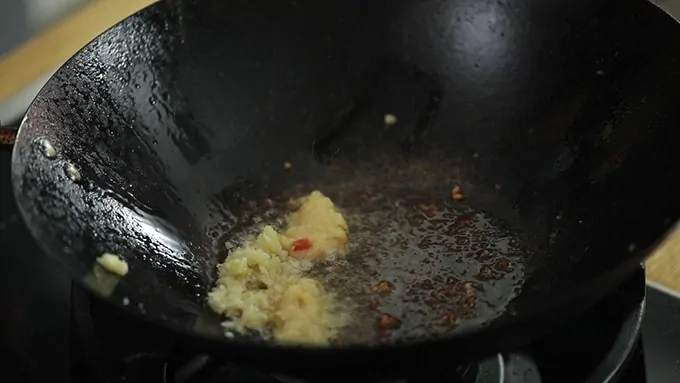 garlic and ginger frying in a wok