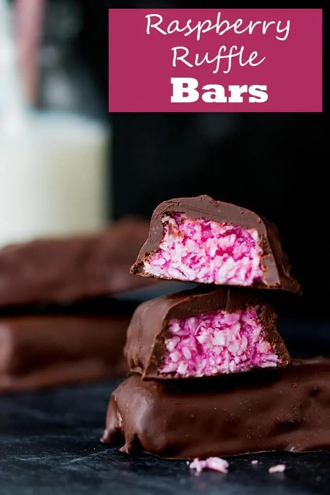 Raspberry Ruffle Bars - A vibrant coconut raspberry snack bar, covered in rich, dark chocolate.