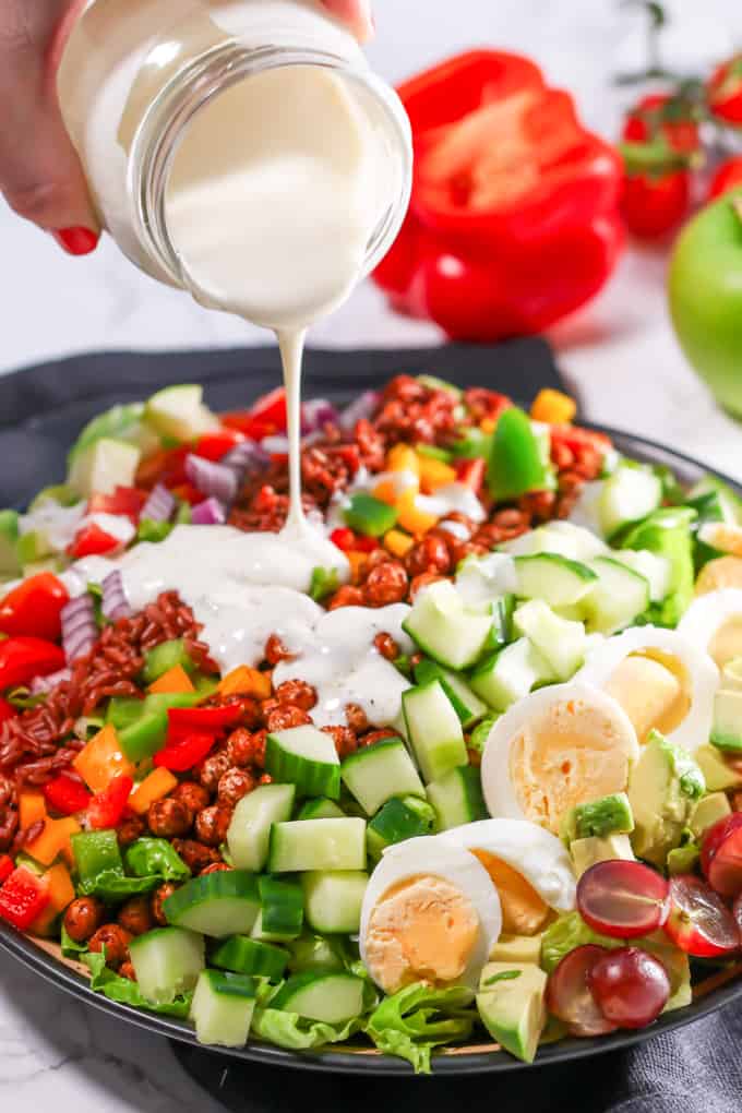 A colourful chopped cob salad with smoky chickpeas and goat's cheese dressing!