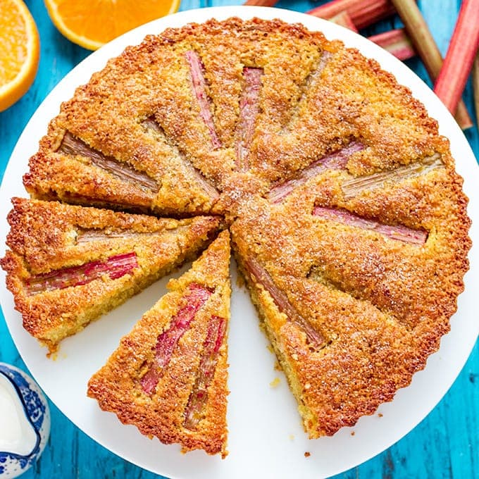 A moist, orange-infused almond cake with juicy rhubarb and amaretto cream.