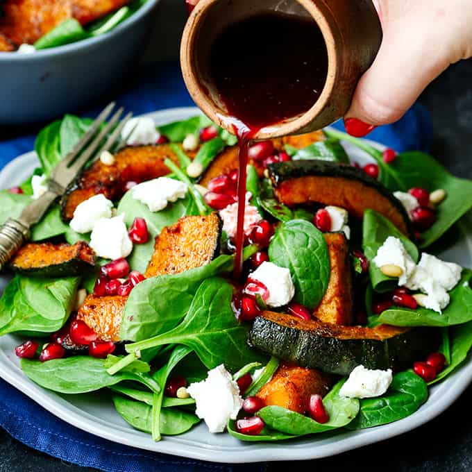 Sweet Roasted Kabocha Squash Salad - with creamy goat's cheese and a tangy pomegranate dressing. A deliciously filling dinner - perfect for Meatless Monday!