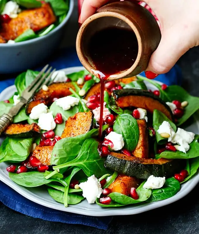 Sweet Roasted Kabocha Squash Salad - with creamy goat's cheese and a tangy pomegranate dressing. A deliciously filling dinner - perfect for Meatless Monday!