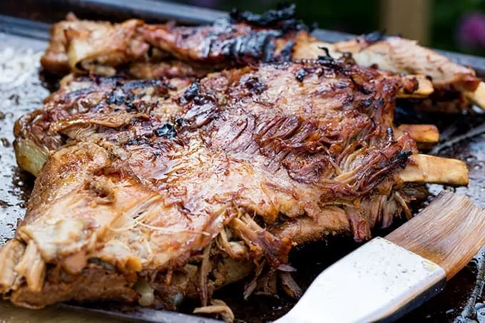 Wide shot of rack of cooked BBQ ribs