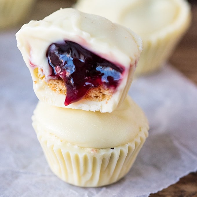 Bite sized creamy white chocolate cups filled with crushed biscuit and cherries - a simple 3-ingredient treat!