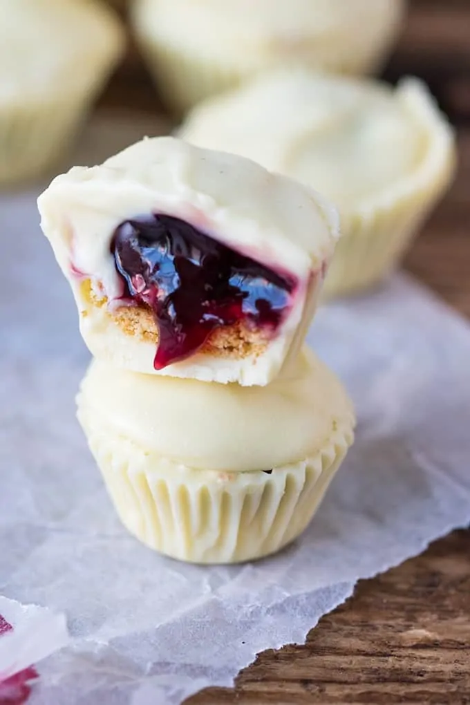 Bite sized creamy white chocolate cups filled with crushed biscuit and cherries - a simple 3-ingredient treat!