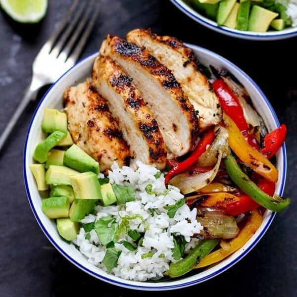 Juicy griddled Cajun chicken with charred veggies and coriander-lime rice – ready in 30 minutes. A great weeknight dinner!