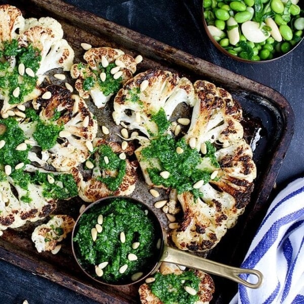 Cauliflower steak with spicy salsa verde. Cauliflower fried until golden, then poached in stock - a great meatless Monday meal!