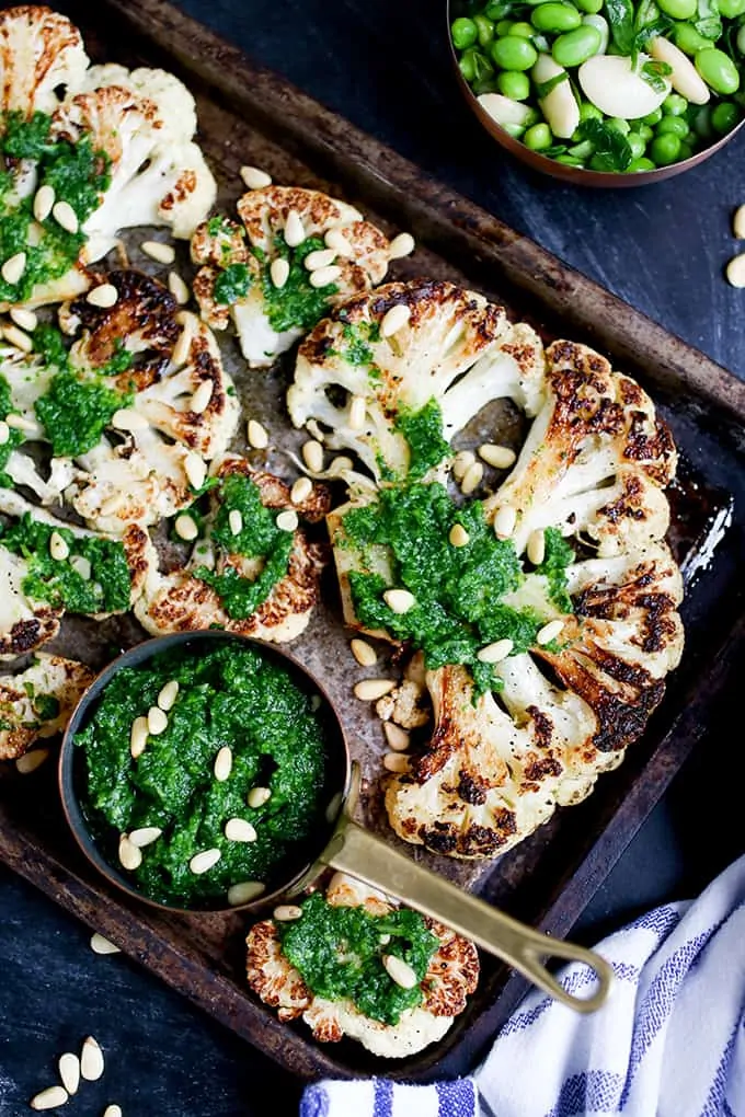 Cauliflower steak with spicy salsa verde. Cauliflower fried until golden, then poached in stock - a great meatless Monday meal!