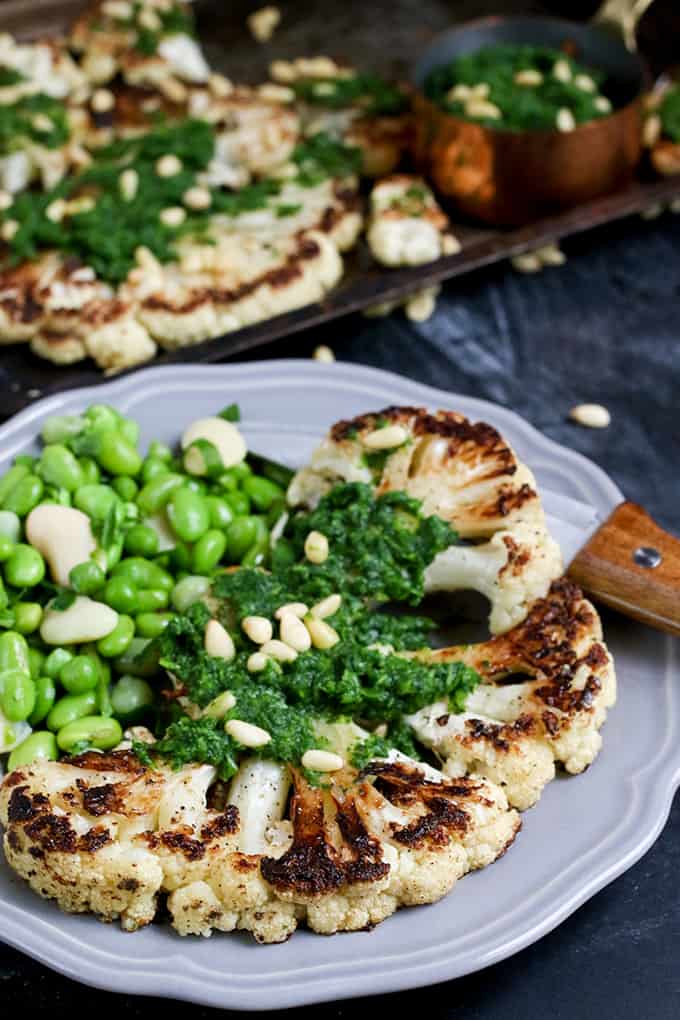 Cauliflower steak with spicy salsa verde. Cauliflower fried until golden, then poached in stock - a great meatless Monday meal!