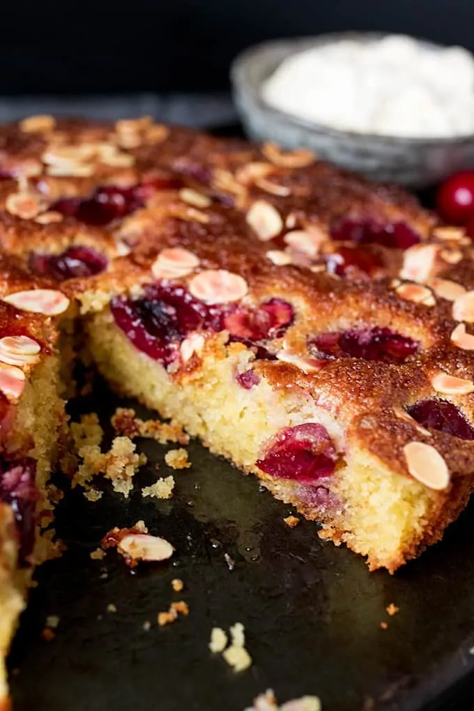 A fluffy Cherry and Almond Cake with fresh cherries and dollops of jam. So tasty and gluten free too!