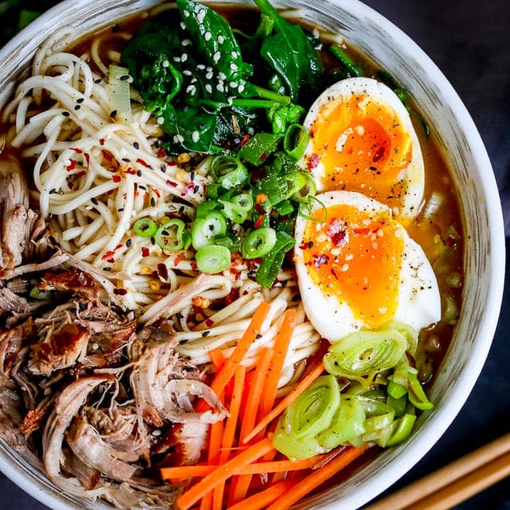 overhead picture of pork ramen with shredded meat and a boiled egg