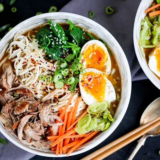 Spicy Pork Ramen - Slow cooked pork with noodles, veggies and a just-slightly-runny egg. Full of that delicious umami flavour!