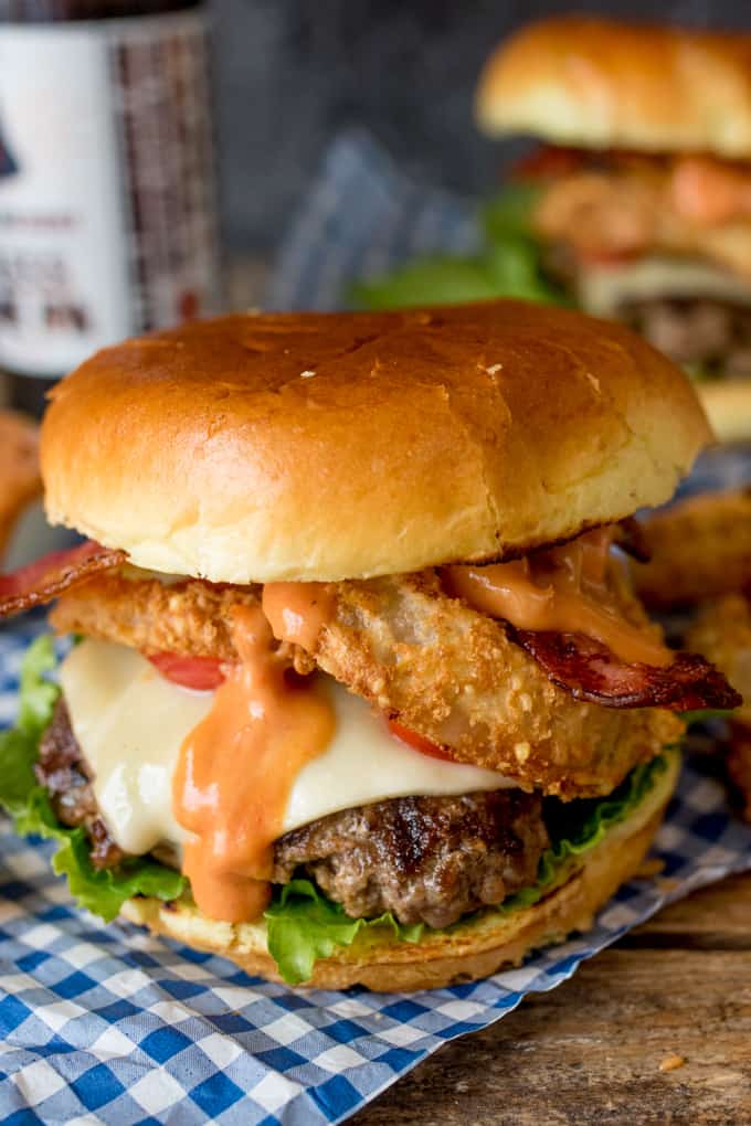 Close up photo of Bacon Cheeseburger with Baked Parmesan Onions Rings