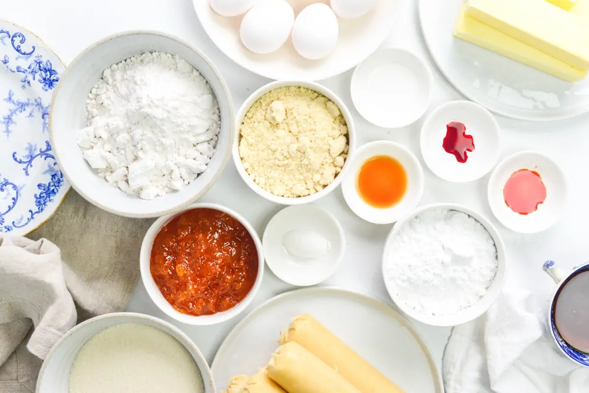 Ingredients for battenberg cake on a white table