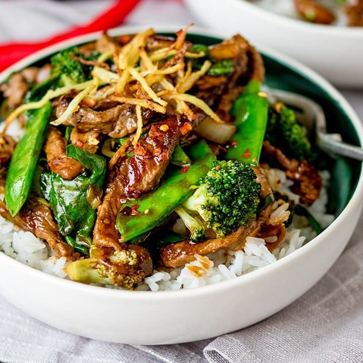 Ginger beef and broccoli in a bowl with rice