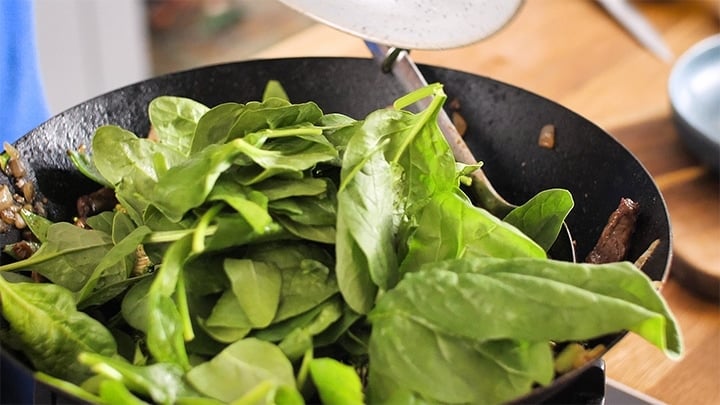 Fresh spinach in a wok