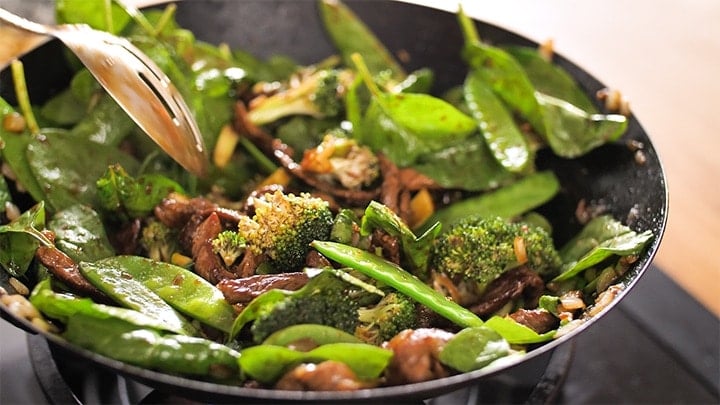Ginger beef stir fry in a wok