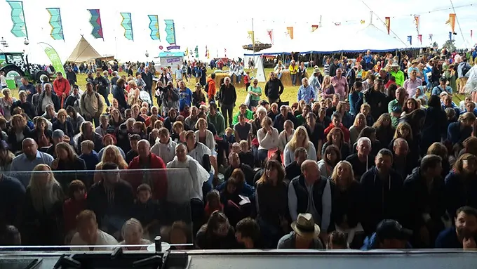 Crowd of people in cookery show audience