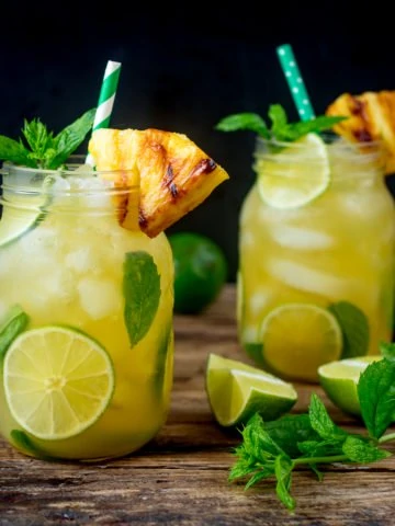 2 Pineapple Ginger Mojitos in mason jars