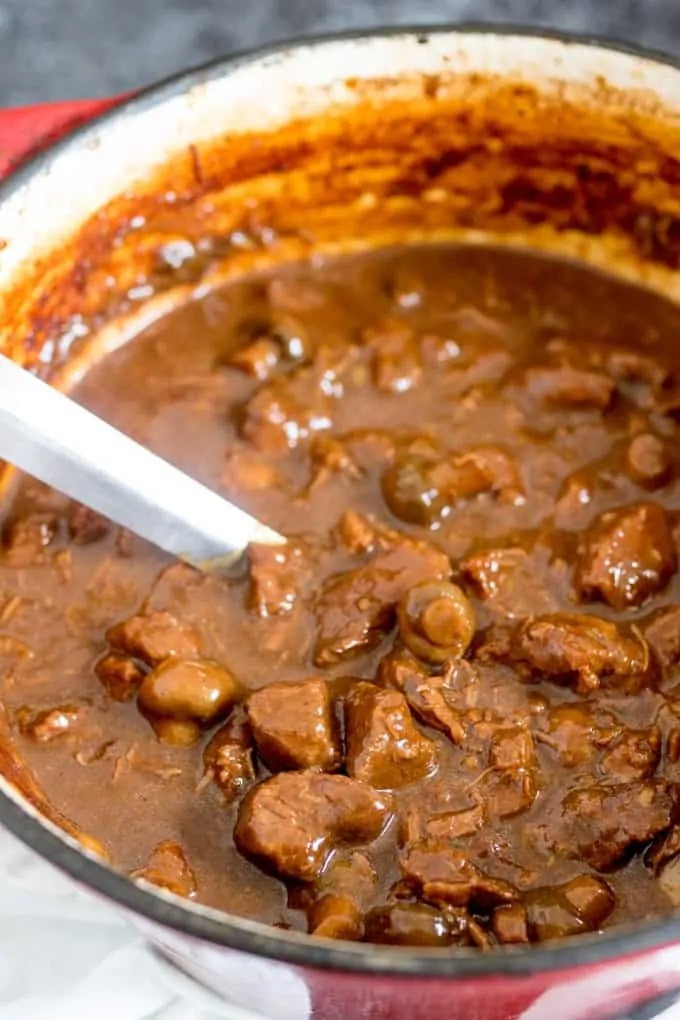 Big Batch Chinese Beef cooking in a dutch oven