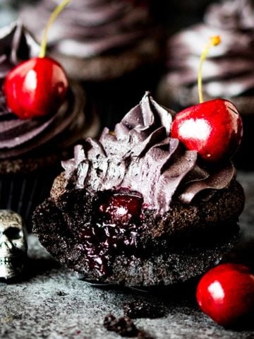 These halloween black cupcakes with cherry filling make a scrumptiously spooktacular dessert!