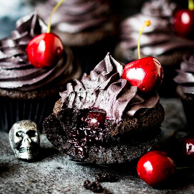 These halloween black cupcakes with cherry filling make a scrumptiously spooktacular dessert!