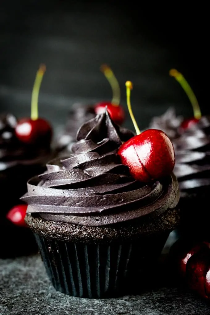 These halloween black cupcakes with cherry filling make a scrumptiously spooktacular dessert!