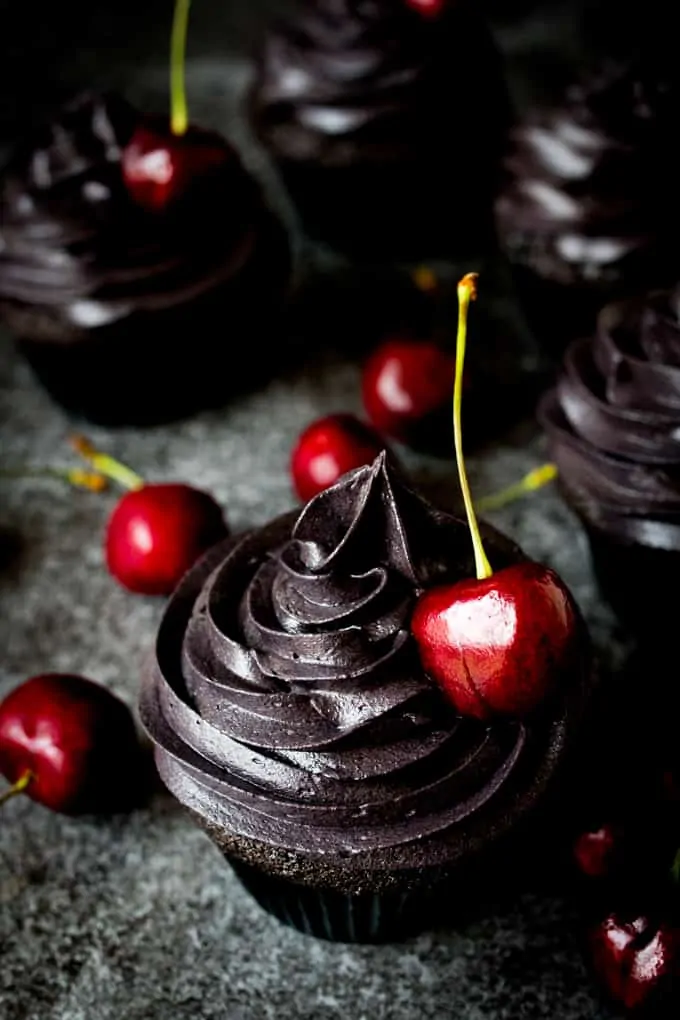 These halloween black cupcakes with cherry filling make a scrumptiously spooktacular dessert!