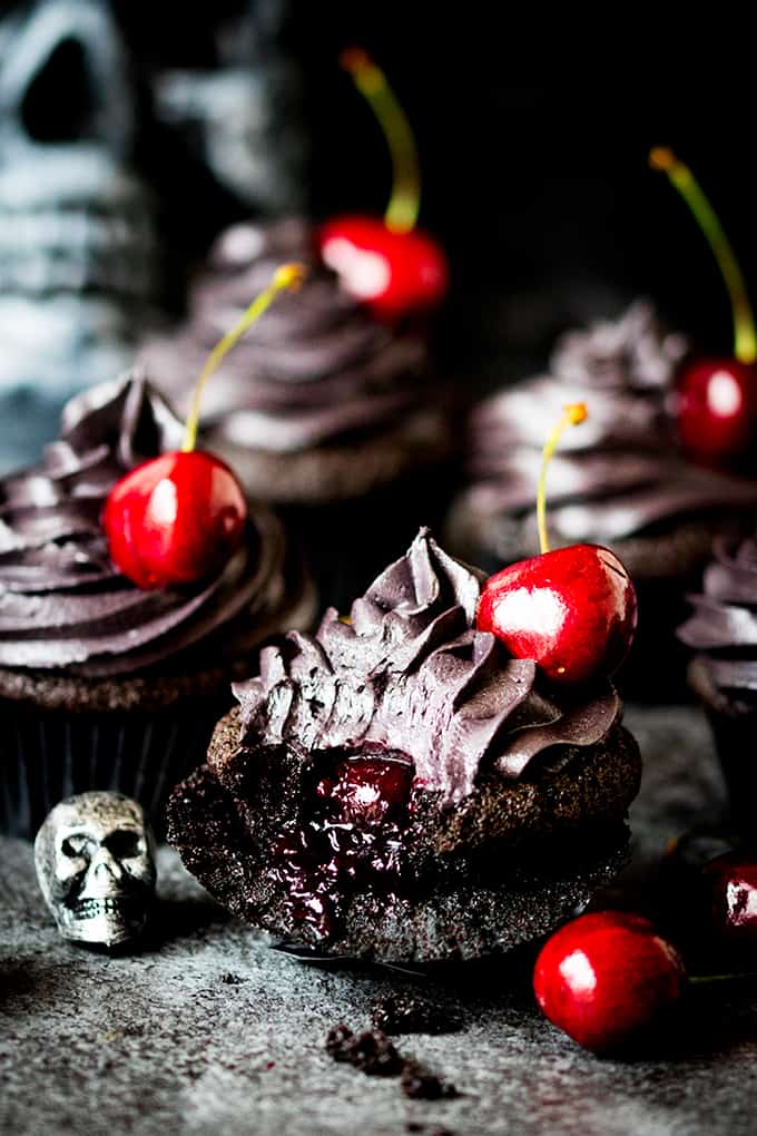 These halloween black cupcakes with cherry filling make a scrumptiously spooktacular dessert!
