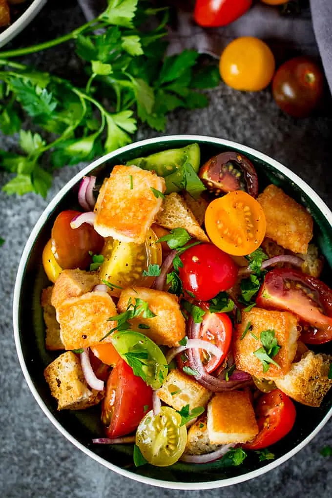 Panzanella Salad with Saganaki - Italy meets Greece in this juicy Tuscan tomato salad with crispy fried Greek cheese.