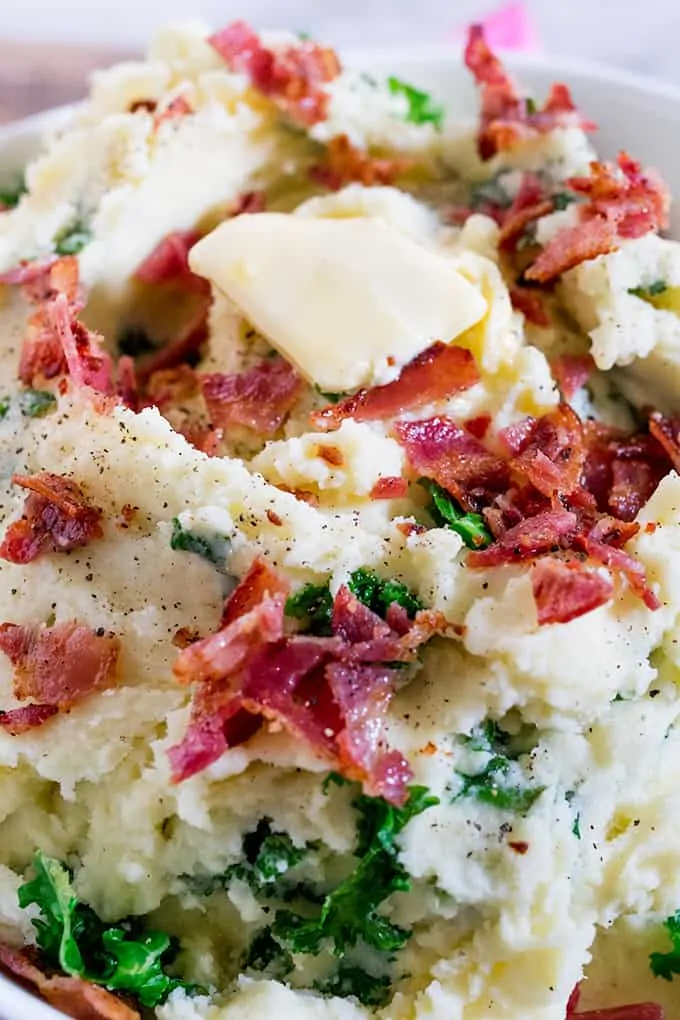 Buttery Kale and Bacon Mashed Potatoes makes a great side dish - or even a meal in itself! Perfect as a side dish for Christmas or Thanksgiving.