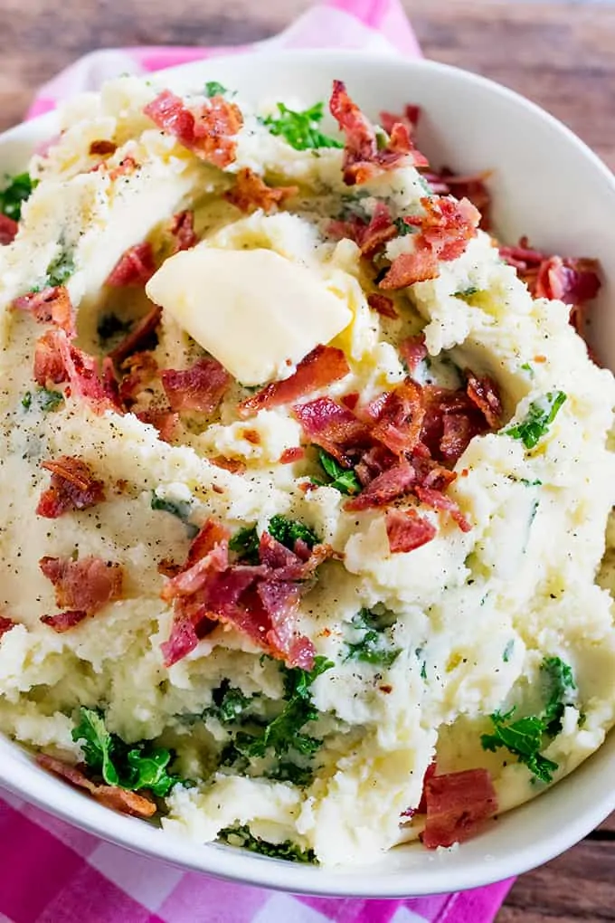 Buttery Kale and Bacon Mashed Potatoes makes a great side dish - or even a meal in itself! Perfect as a side dish for Christmas or Thanksgiving.