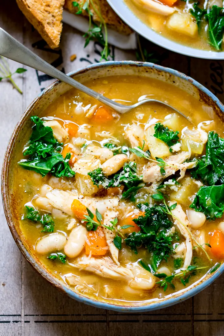 Overhead photo of Tuscan Style Chicken Soup in a stone bowl