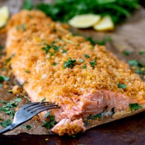 This Garlic Bread Crusted Salmon makes an easy and tasty centerpiece for your family table! The crispy coating ensures the salmon is beautifully moist!