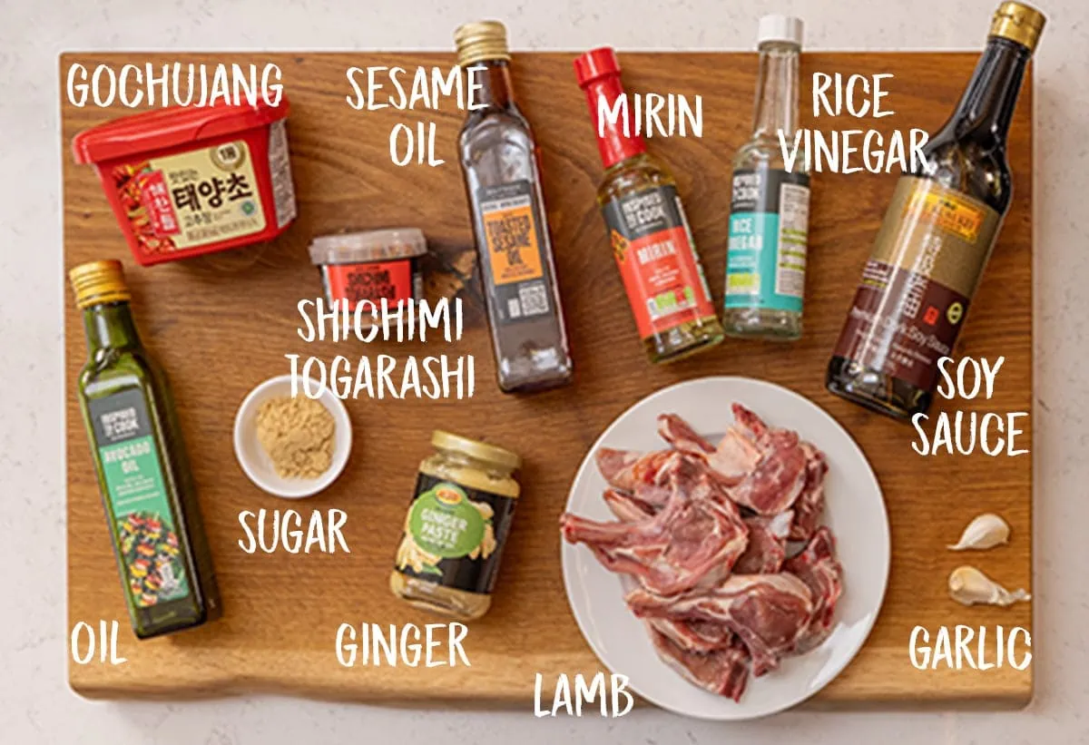 Ingredients for Korean-style lamb cutlets on a wooden board.
