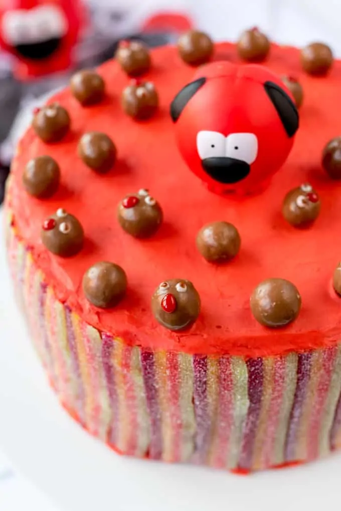 Colourful Layers, Vimto Buttercream And Fizzy Rainbow Belt Coating - Finished Off With Little Malteser Faces! All the right ingredients for a wacky Red Nose Day Rainbow Cake!