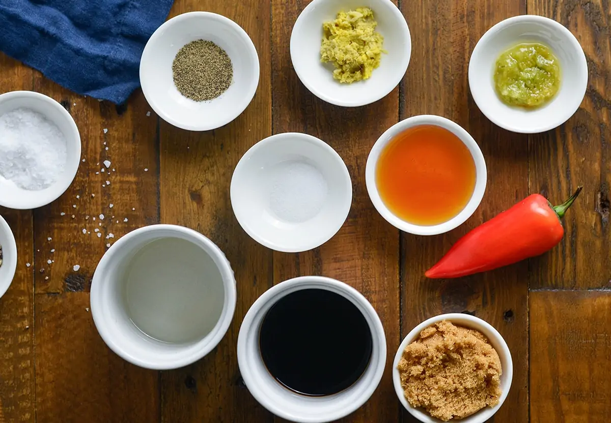 Ingredients for a sticky chilli glaze on a wooden table