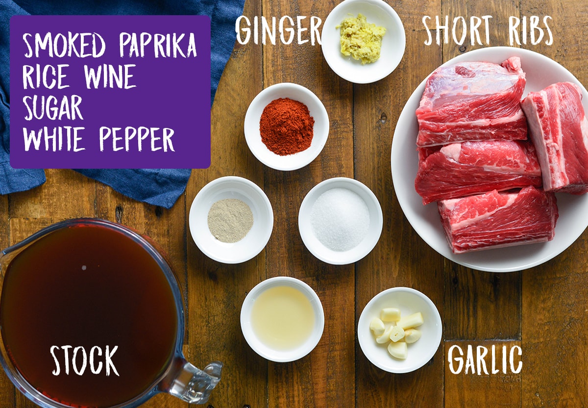 Ingredients for slow cooked Short ribs on a wooden table
