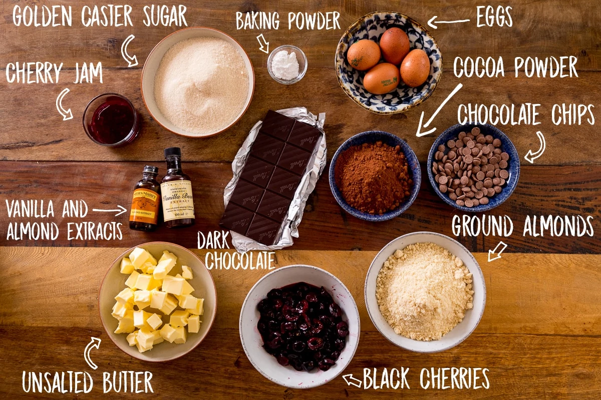 Ingredients for Chocolate Cherry Cake on a wooden table